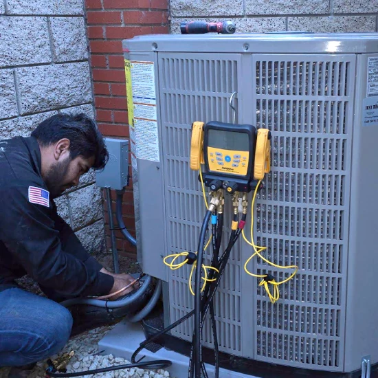 img of OUR TECHNICIANS SERVICING AN HVAC UNIT